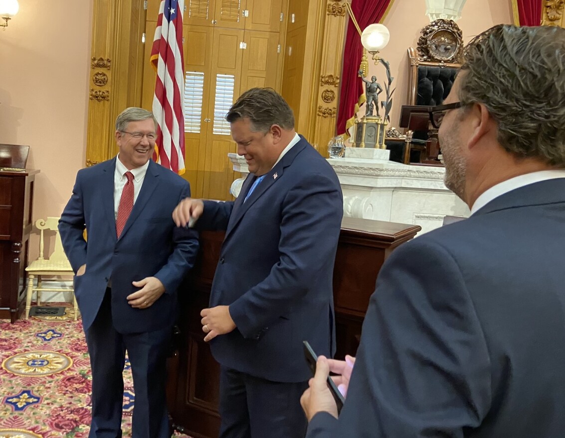 Speaker Bob Cupp (R-Lima, left) laughs with Rep. Jon Cross (R-Kenton) after session on July 30, as Rep. Todd Smith (R-Farmersville) looks on. Cross is among the Republicans who have proposed bills to push back on Gov. Mike DeWine's public health orders.